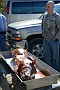 slides/DSC_3259_20081018-005.jpg  The line forms early for the club's annual pig roast. Hot out of the grill.
